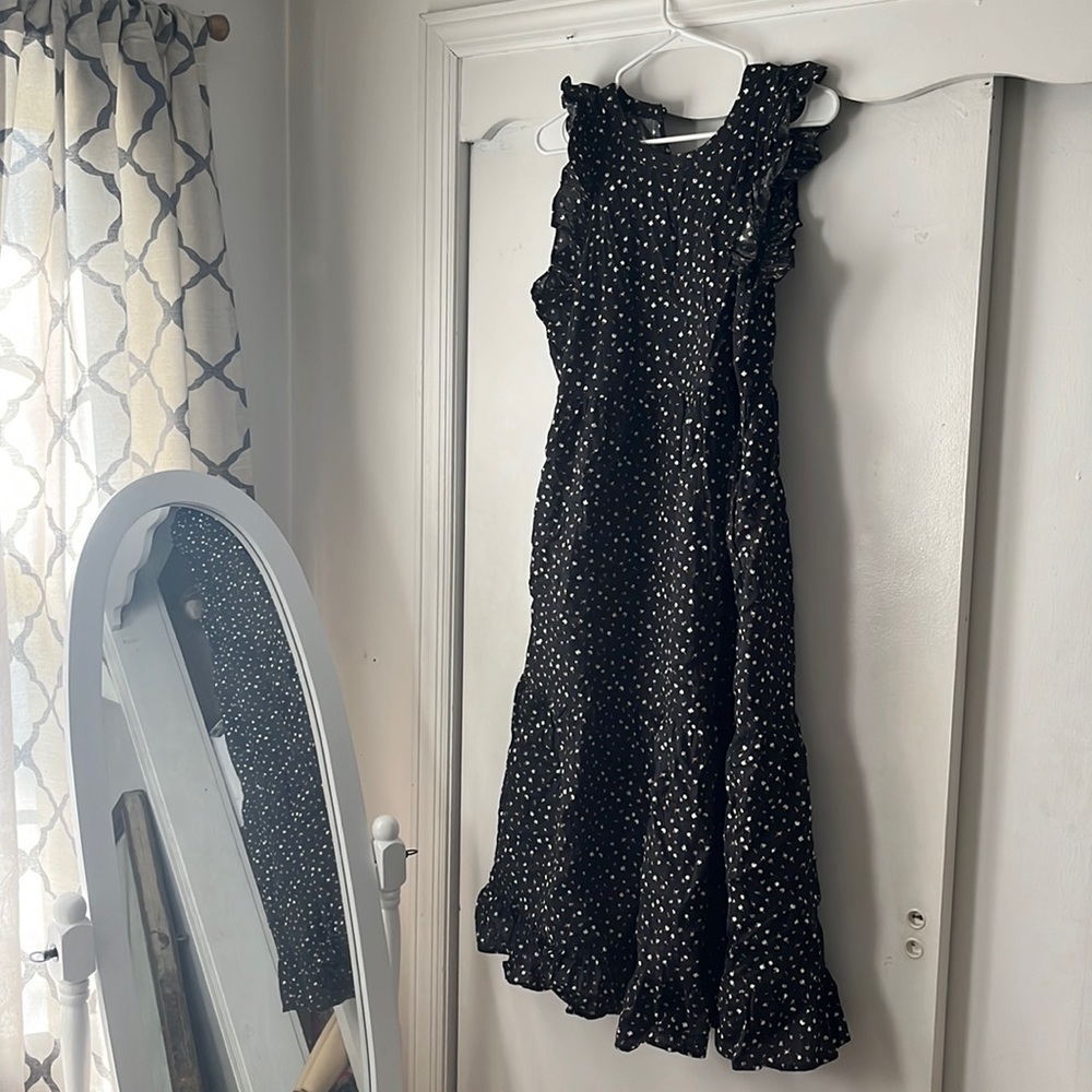 Long flowy black floral dress with ruffle detail